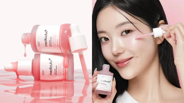 Model using Medicube PDRN Pink Peptide Serum with up close shot of pink serum