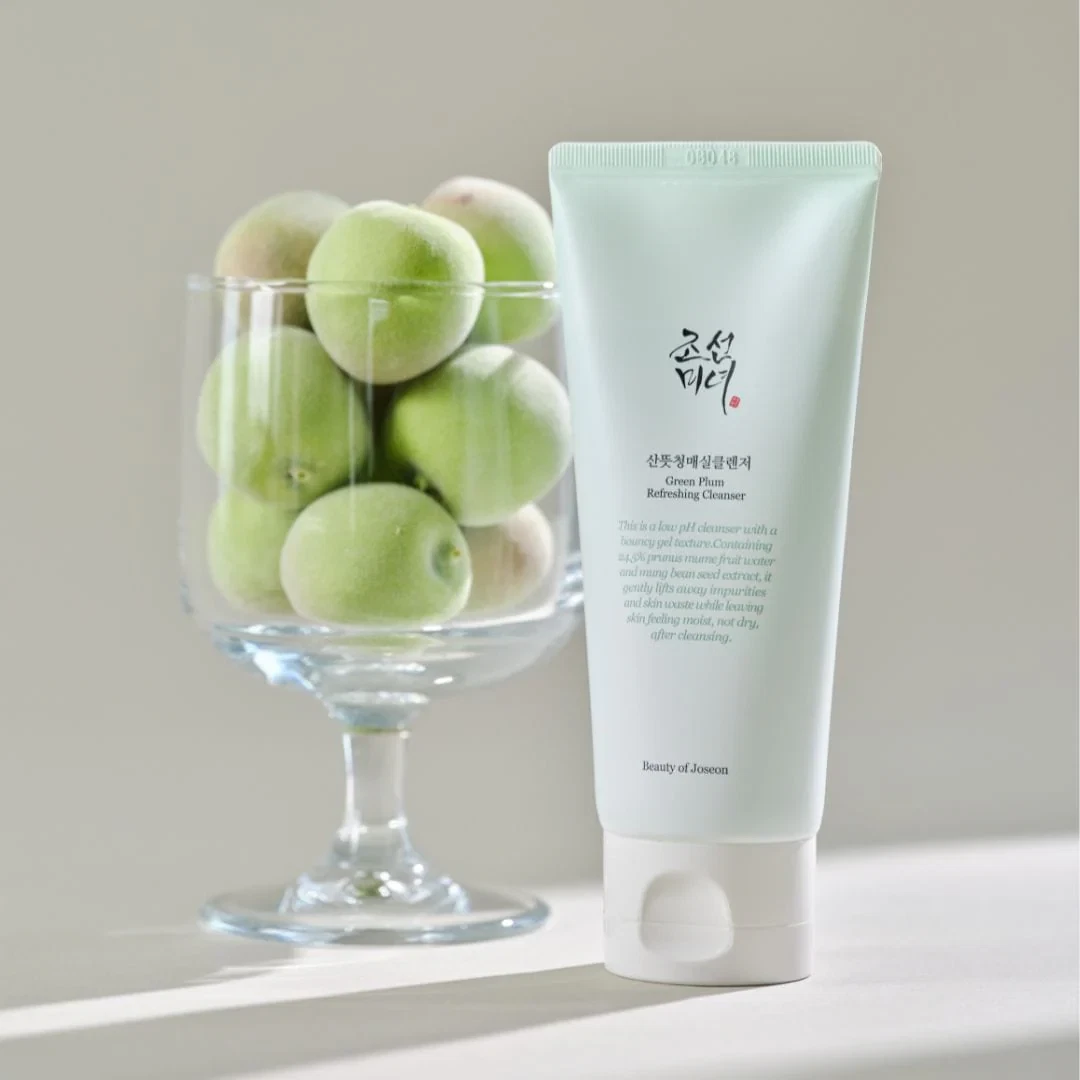 Beauty of Joseon Green Plum Refreshing Cleanser with a background jar of green plums