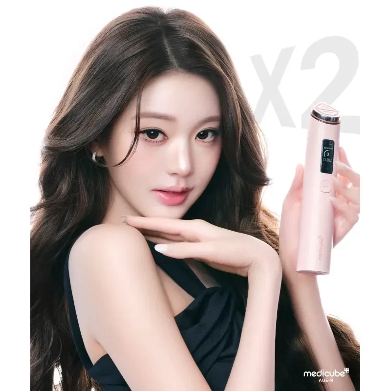 Model holding the pink Booster Pro X2