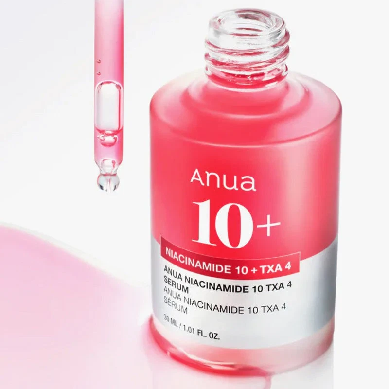 Anua Niacinamide 10 TXA 4 Serum with open applicator dripping pink serum
