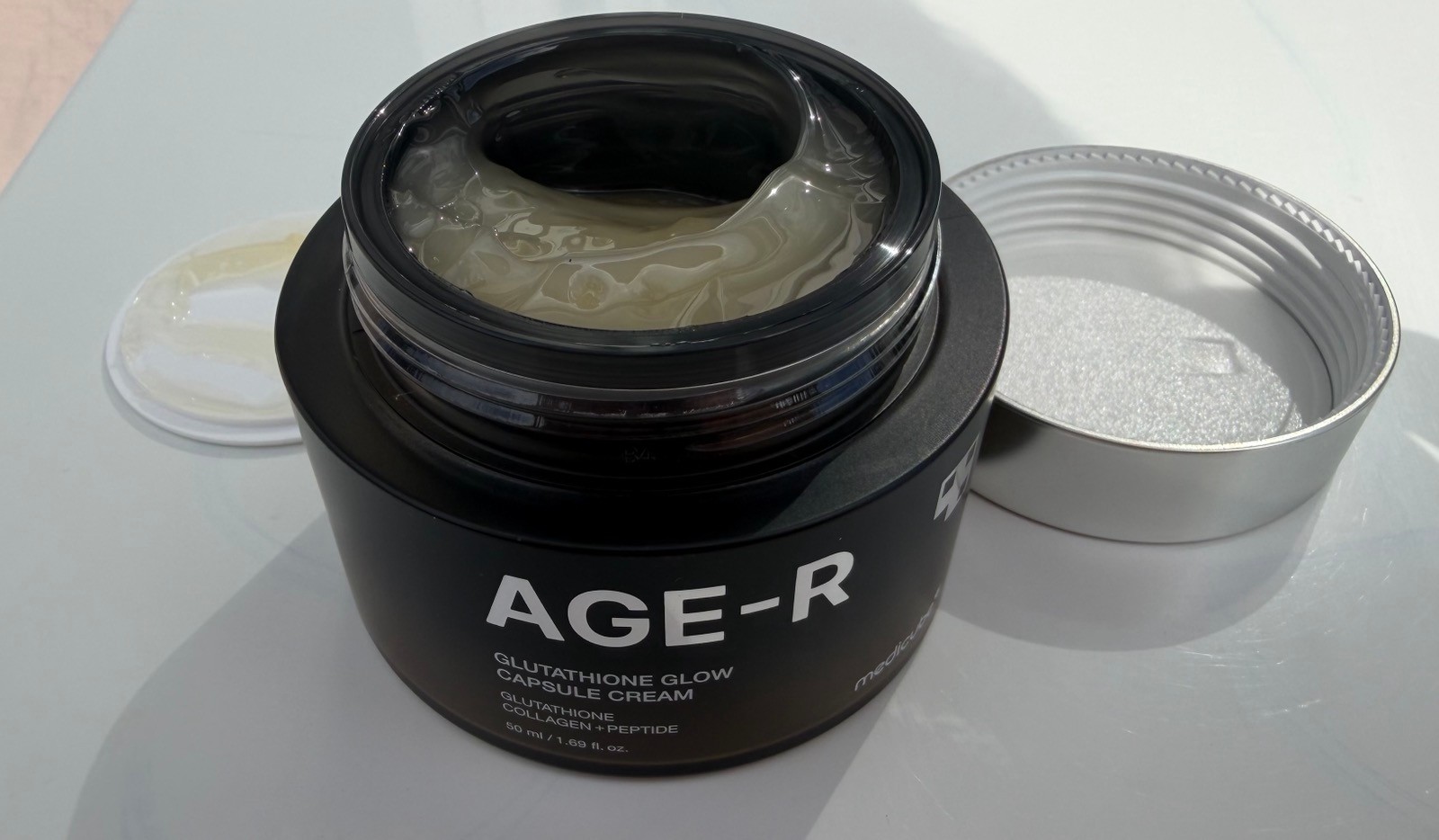 AGE-R Glutathione Glow Capsule Cream Medicube Applicator showing close up of cream