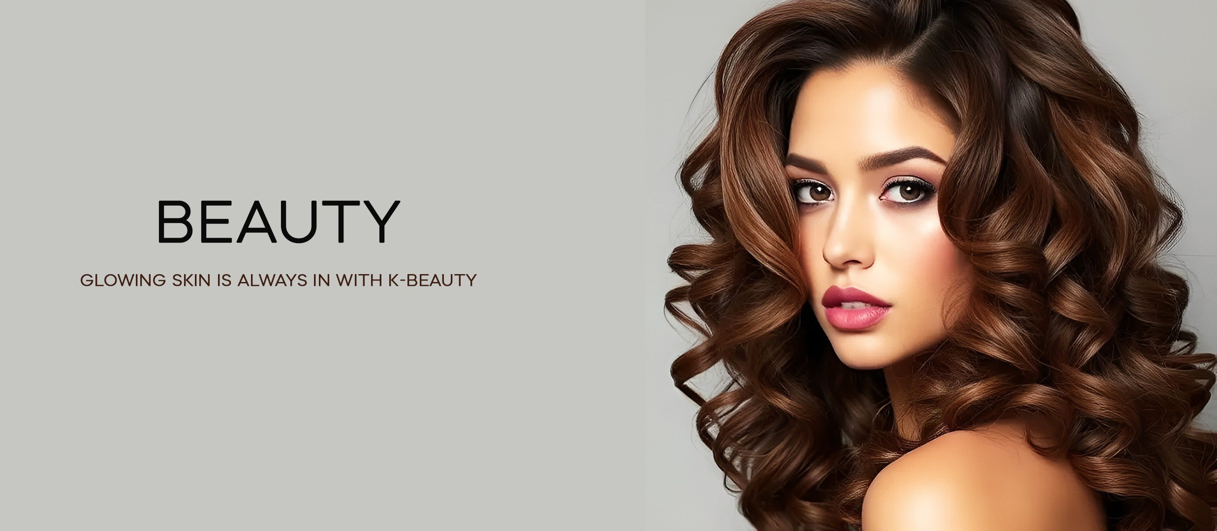 Woman wearing dressing gown and white head band with gold eye patches, applying serum