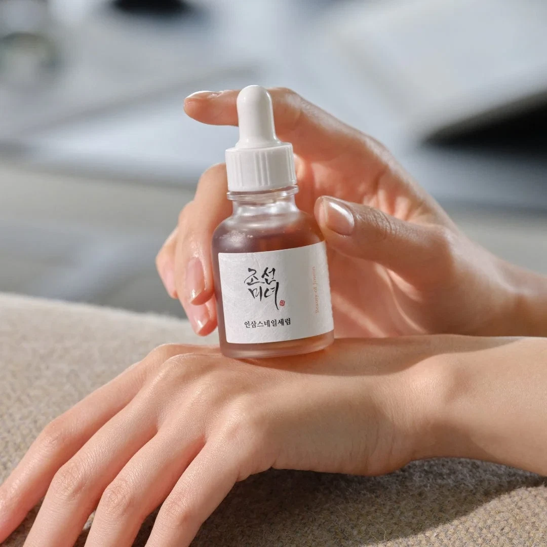 Beauty of Joseon Revive Ginseng and Snail Mucin Serum resting on back of hand