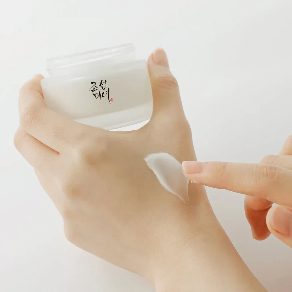 Beauty of Joseon Dynasty cream jar being held and applied to hand