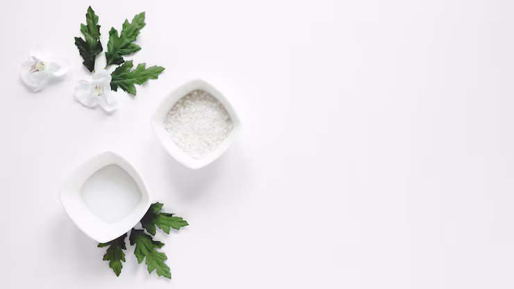 View of white pots with flowers, rice and green leaves