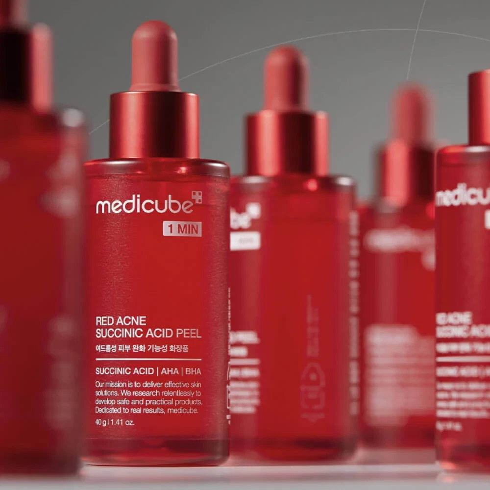 Medicube Red Acne Succinic Acid Peel bottles in a cluster