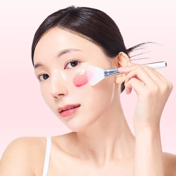 Dr Melaxin TXA-Astaxanthin Overnight Wrapping Mask being used by model