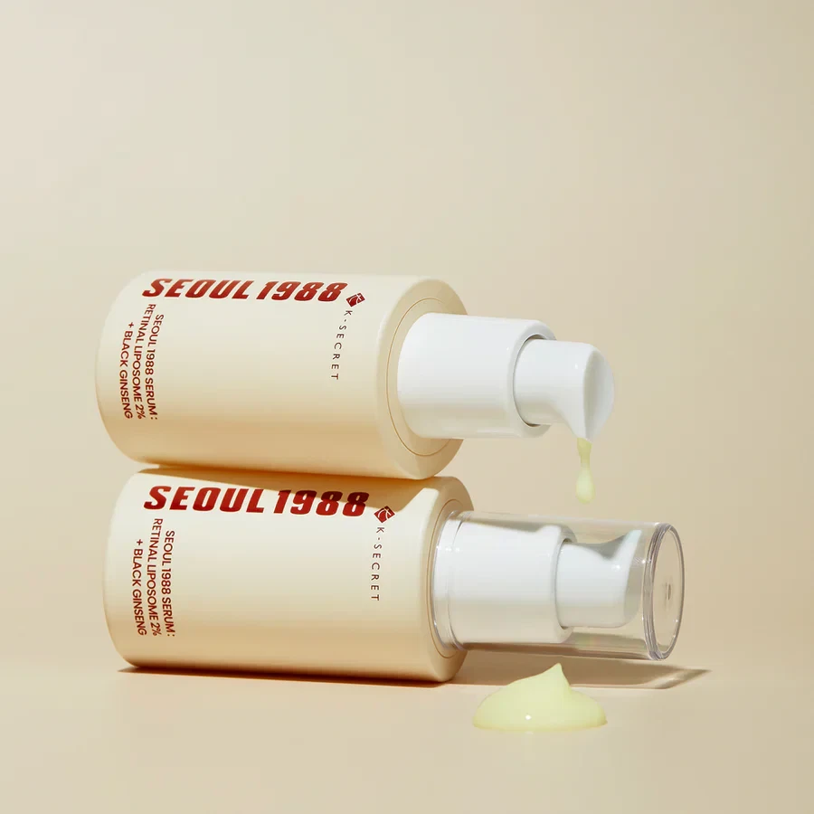 KSECRET Seoul 1988 Serum: Retinal Liposome 2% + Black Ginseng bottles lying atop each other with yellow, dripping serum