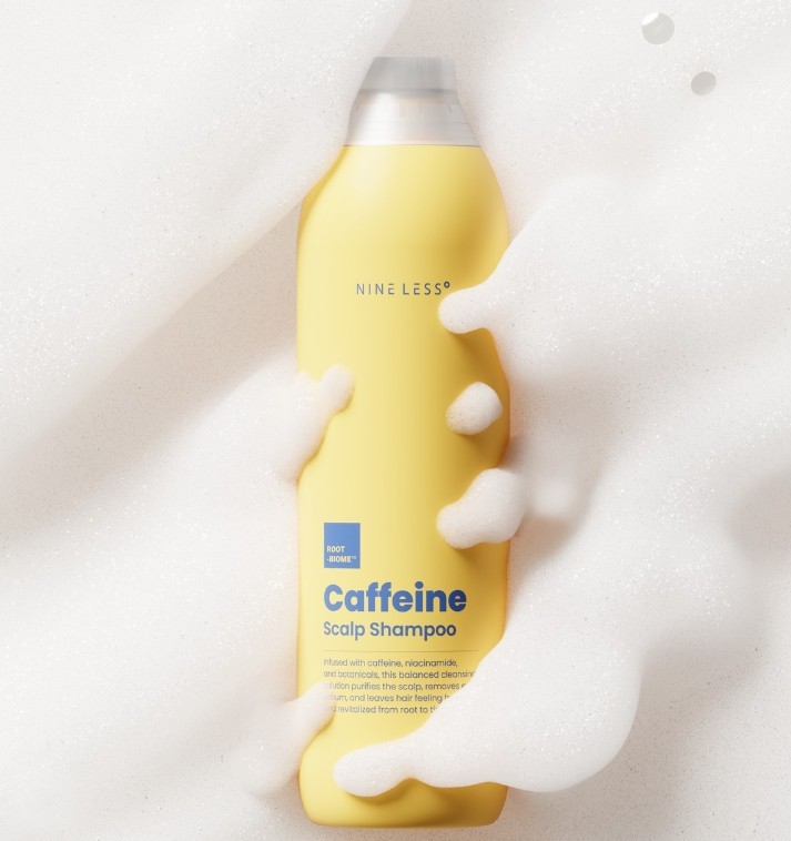 Nine Less Caffeine Scalp Shampoo surrounded in bubbly foam