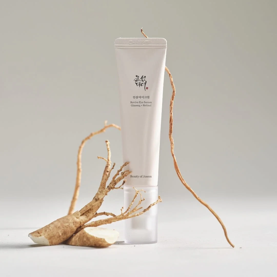 Beauty of Joseon Revive Eye Serum Ginseng and Retinal on white background with wrapping roots of ginseng