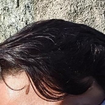 Close up dark hair strands - showing glossy texture