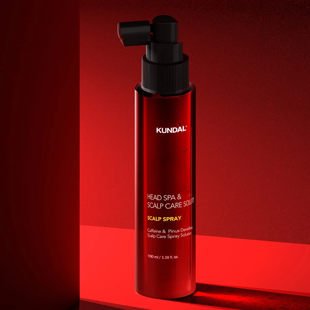 Kundal Head Spa & Scalp Care + Scalp Tonic in a red backdrop