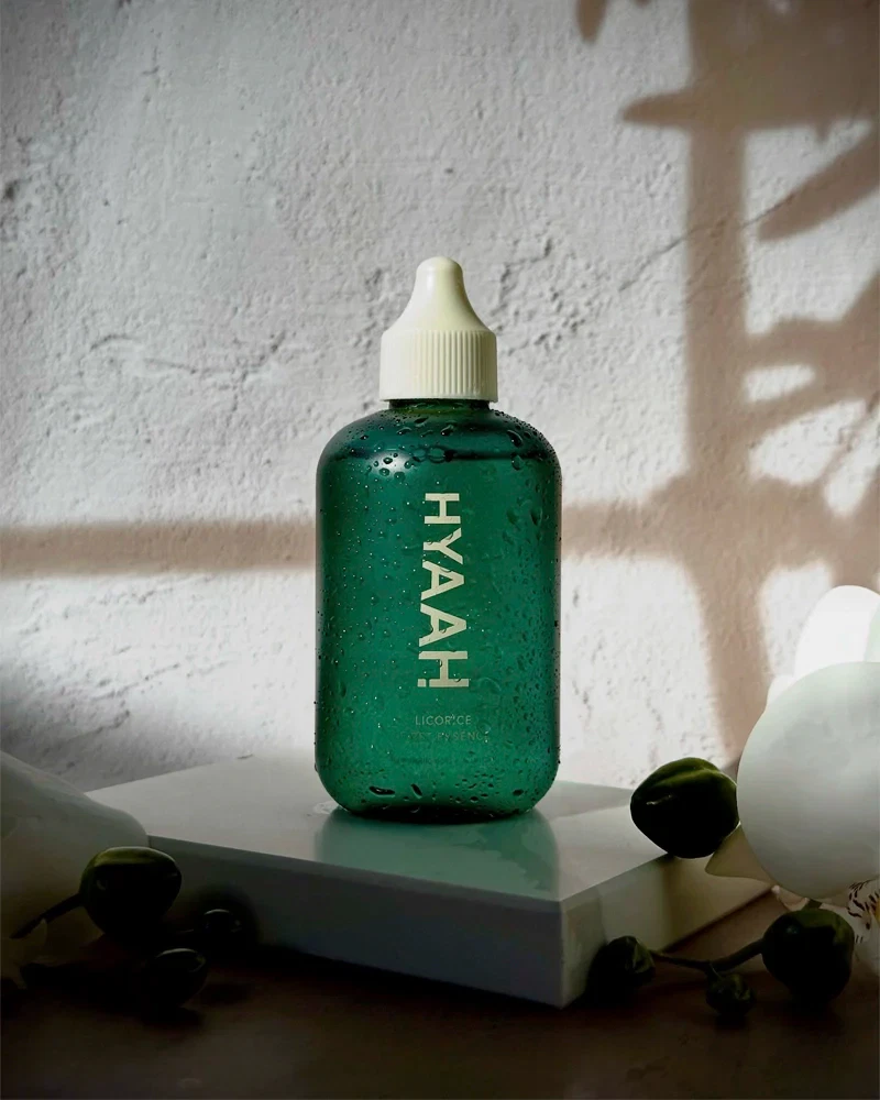 HYAAH First Licorice Essence sitting on end table