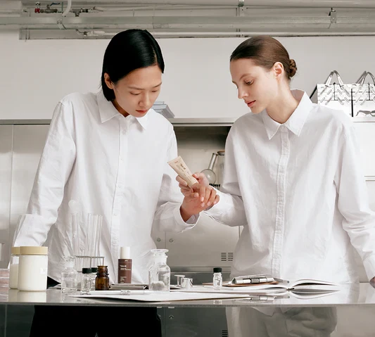 Dr Reju-All Models holding PDRN Advanced Cream in Lab