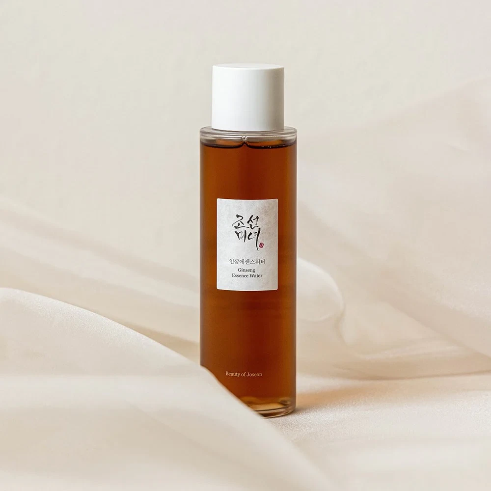 Beauty of Joseon Ginseng Essence Water sitting amongst a wispy, white silk curtain
