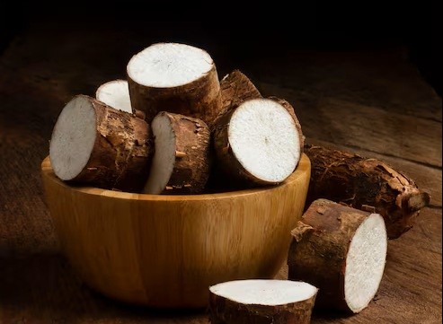 Fresh cuts of cassava, resting in a wooden bowl (source of trehalose)