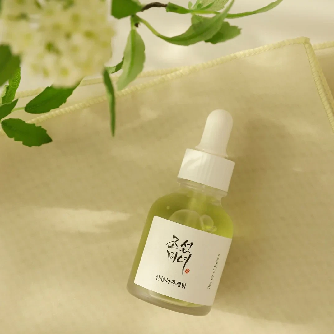 Beauty of Joseon Calming Serum Green tea + Panthenol lying in the shade of green leaves
