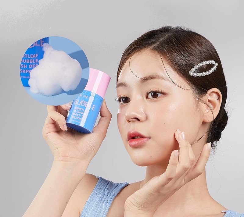 Young model holding the Be The Skin Heartleaf O2 Bubble Wash Off Maskpack