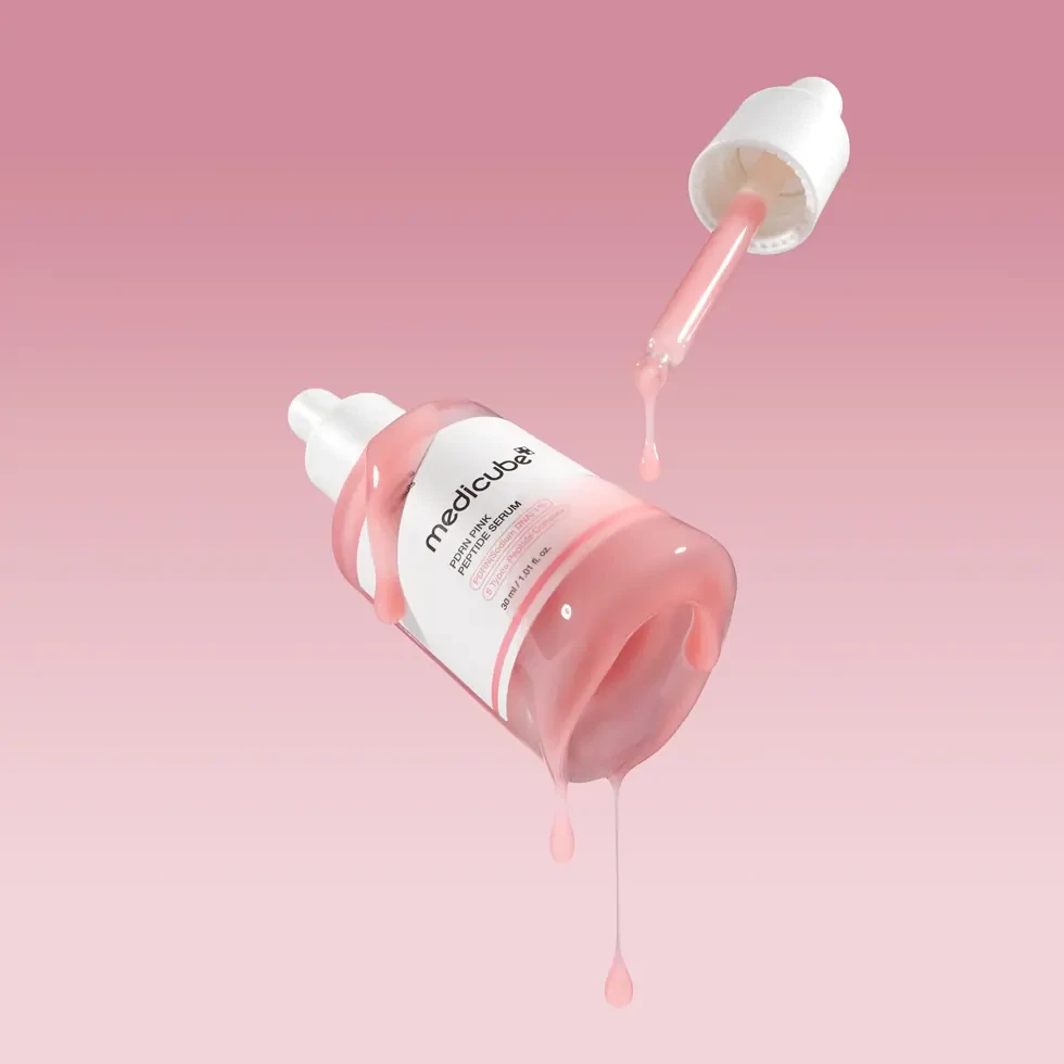 Medicube PDRN Pink Peptide Serum suspended in pink background