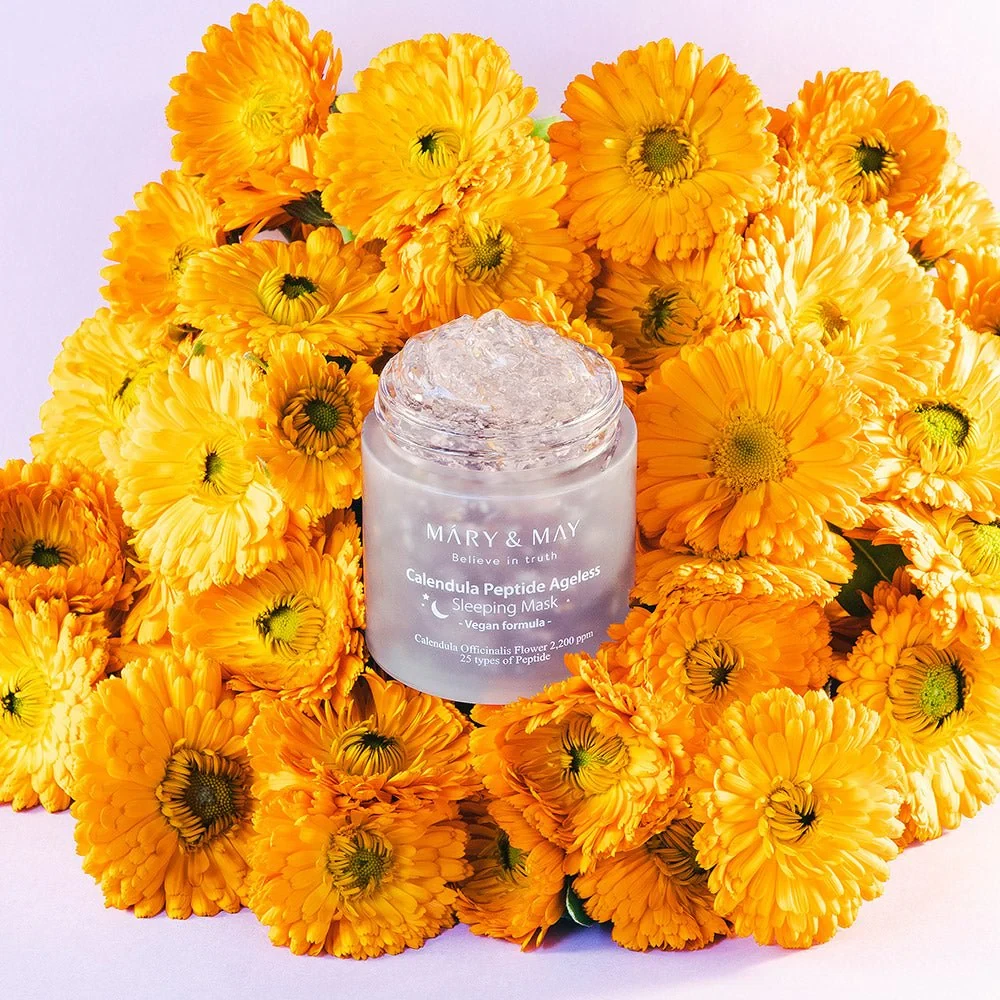 Mary and May Calendula Peptide Ageless Sleeping Mask on bed of calendula