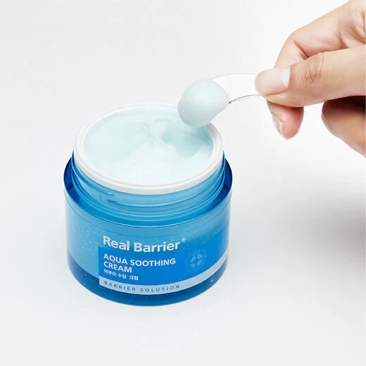 Aqua Soothing Cream with little spoonful being held up to camera, showing light-blue cream jelly