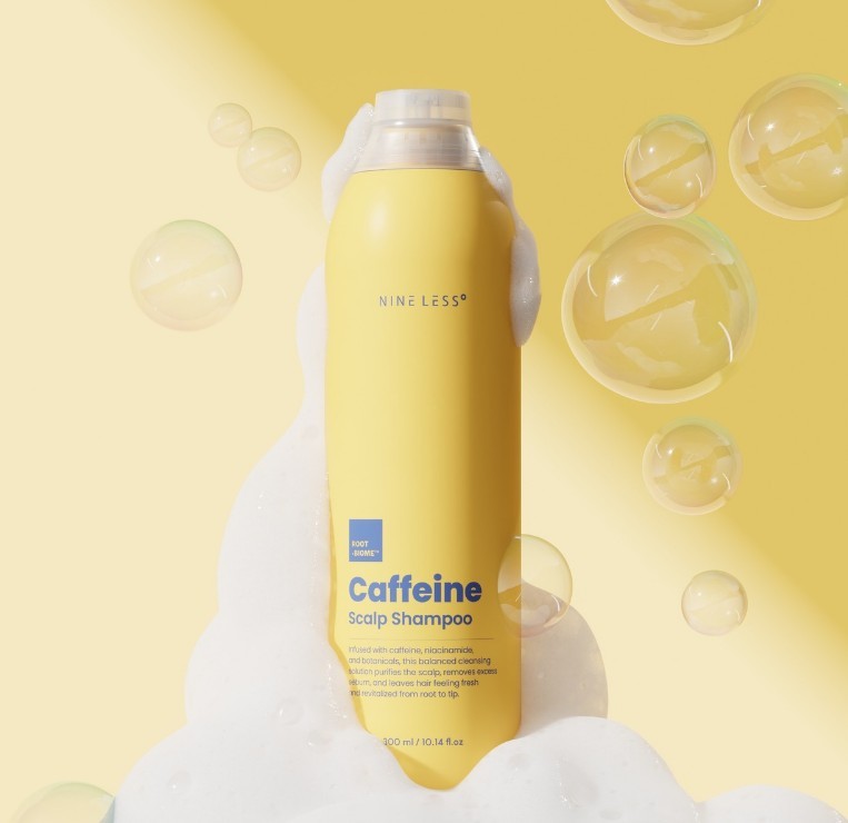 Nine Less Caffeine Scalp Shampoo surrounded by bubbles