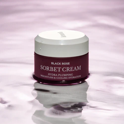 Heimish Black Rose Sorbet Cream Hydra Plumping sitting in purple water