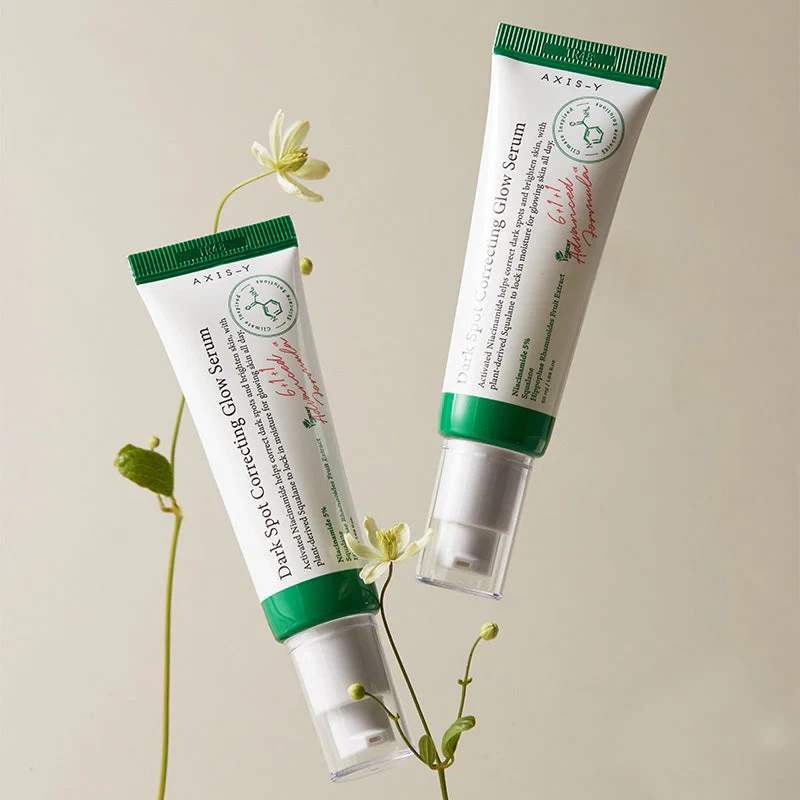 Axis Y Dark Spot Correcting Glow Serum with little yellow flowers