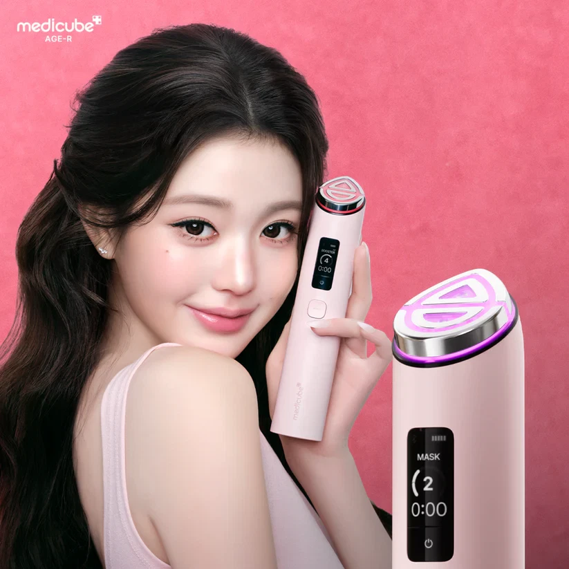 Medicube AGE-R Booster Pro X2 held by model