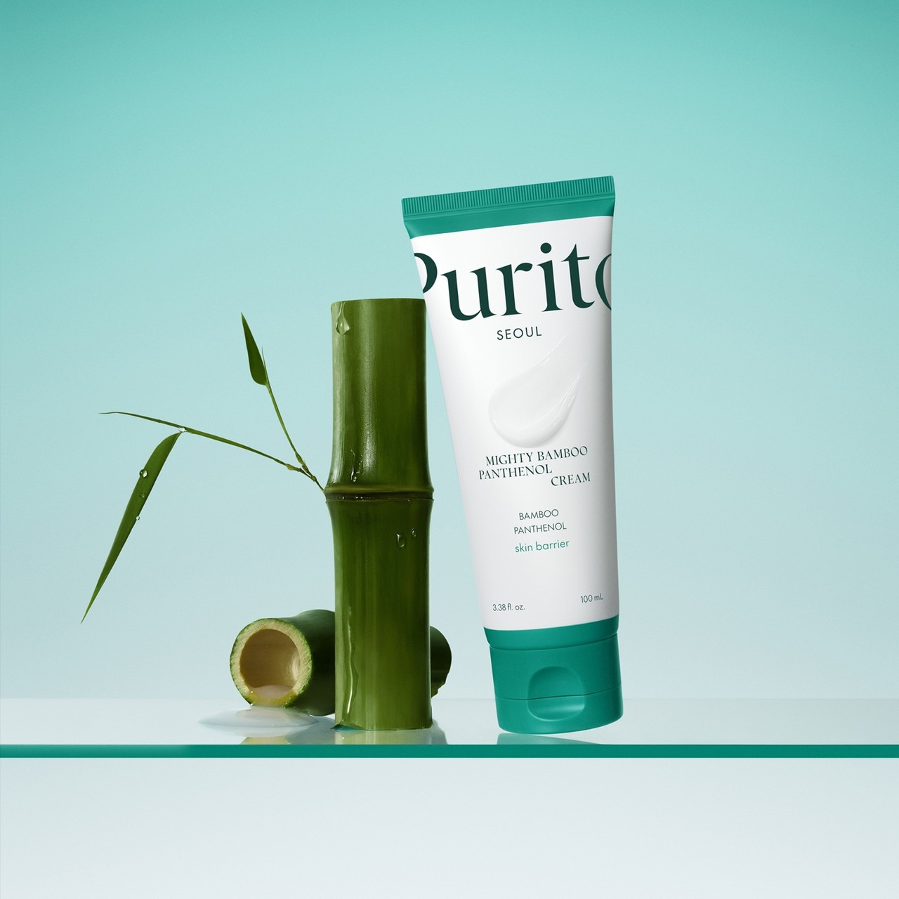 Purito Seoul Mighty Bamboo Panthenol Cream resting against bamboo on a green background
