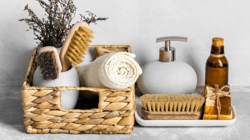 Variety of earth-toned bath products, including a soap, brush, towel and scrubbing brush