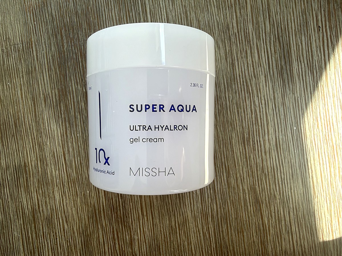 Missha Super Aqua Ultra Hyalron Gel Cream jar with 10x hyaluronic acid on a wooden table