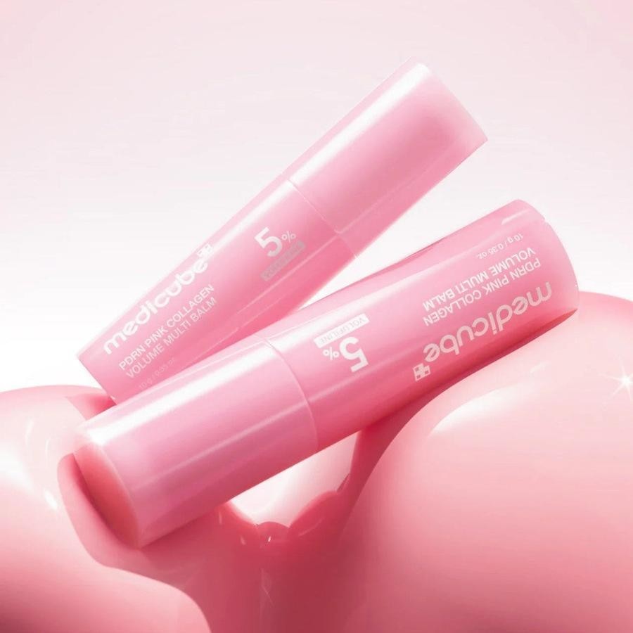 Medicube PDRN Pink Collagen Volume Multi Balm resting on a pink balloon