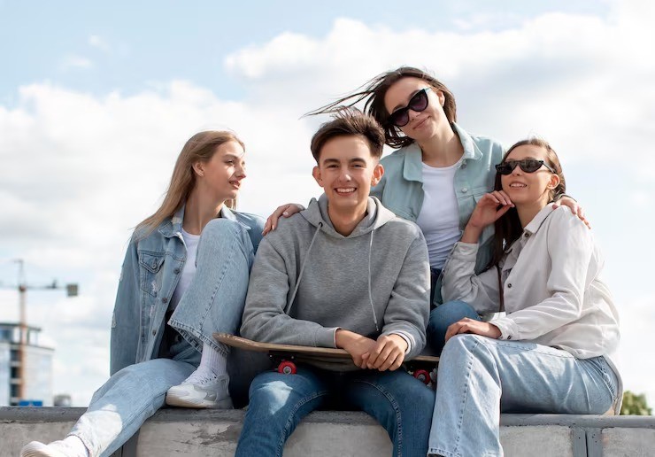 Young group of teenagers posing together at a skate park