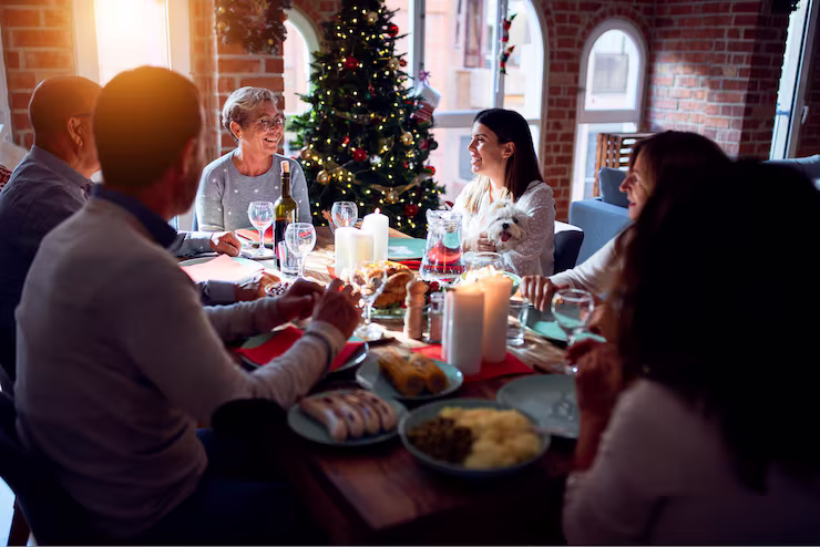 Merry Christmas gathering sitting around a decorated table
