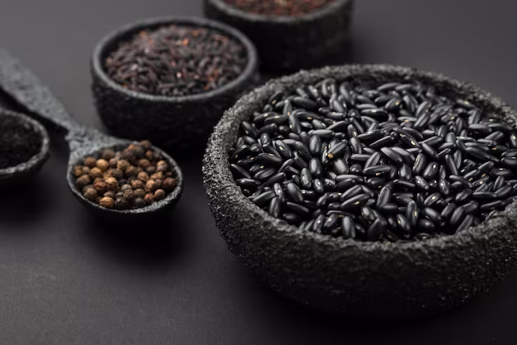 Black rice and Black Pepper staged in Black Bowls