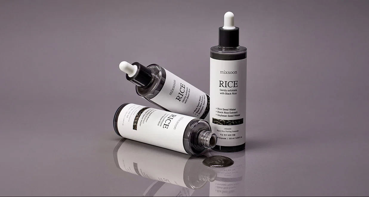 Mixsoon Black Rice Peeling Shot lying in a cluster with spilled serum