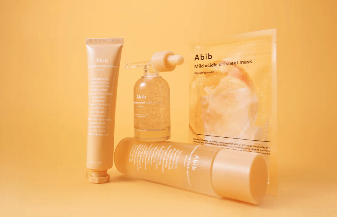 Abib Glutathiosome Skincare Line in Vibrant Orange Background